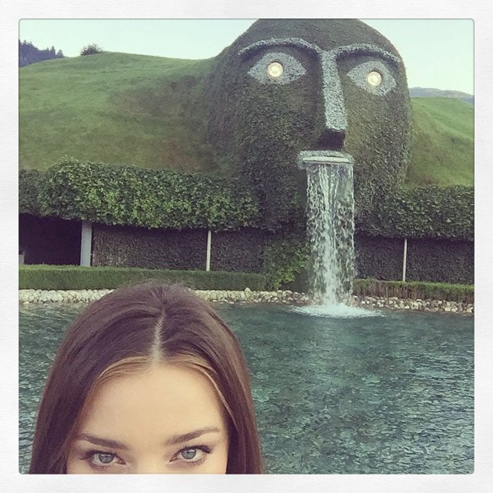 Miranda Kerr takes a selfie at the launch event of her jewelry collection