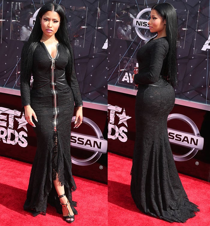 Nicki Minaj slipped into a $9,200 figure-hugging Givenchy gown in black floral lace featuring long sleeves with zipper trims, a flared ruffled skirt, and a huge zip fastening along the front