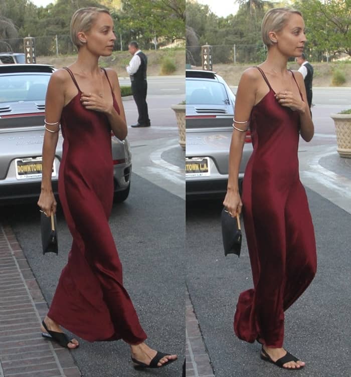 Nicole Richie stuns in a sleek, burgundy slip dress paired with the House of Harlow 1960 gold bangle worn as an arm band for an effortlessly chic and edgy look