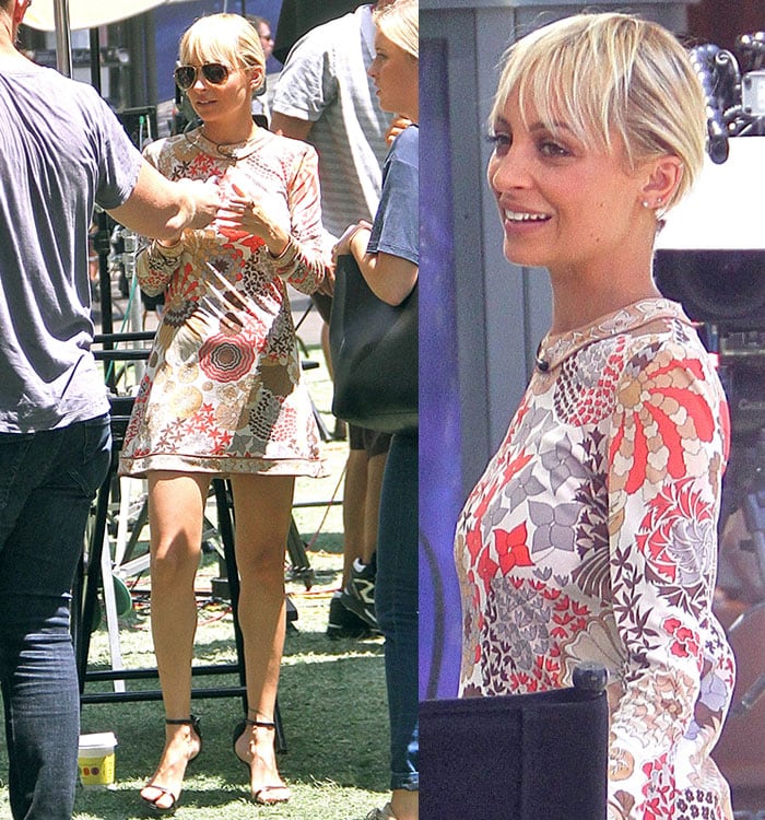 Nicole Richie flaunts her legs in a retro floral mini dress paired with sleek Saint Laurent “Jane” sandals while promoting Candidly Nicole in West Hollywood