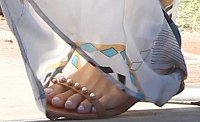Vanessa Hudgens shows off her fresh pedicure in stylish Vince Camuto "Hopper" flats adorned with pearl embellishments
