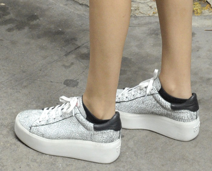 Victoria Justice in crackled leather Ash trainers