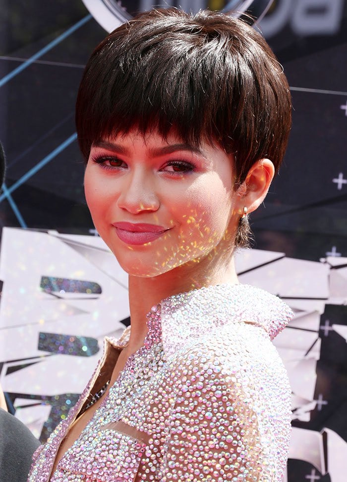 Zendaya's makeup was soft with pastel shades that complemented the jewel hues of her bedazzled frock