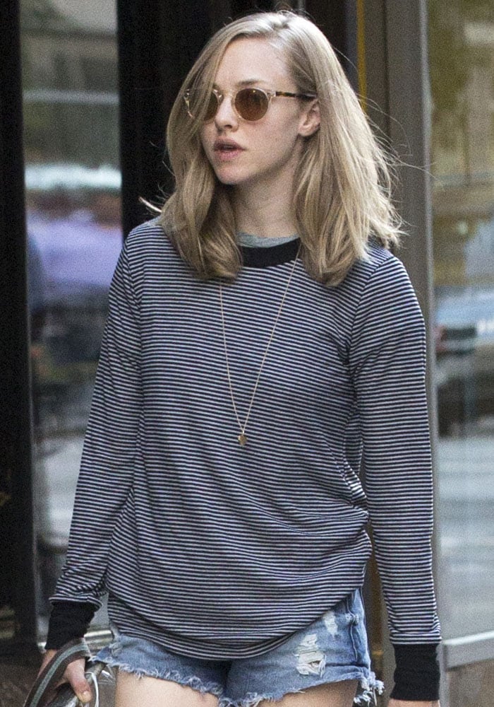 Amanda Seyfried in a long-sleeved striped top and denim cutoffs