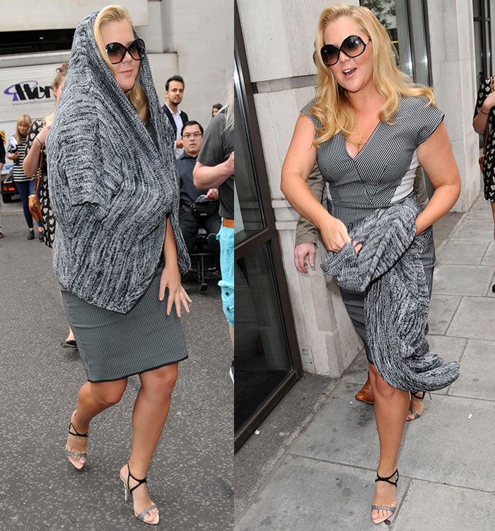 Amy Schumer covered up with a gray knit cardigan