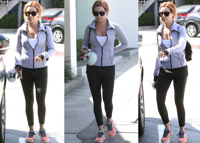 Ashley Tisdale adds a pop of coral to her monochrome gym ensemble with atomic pink Nike sneakers