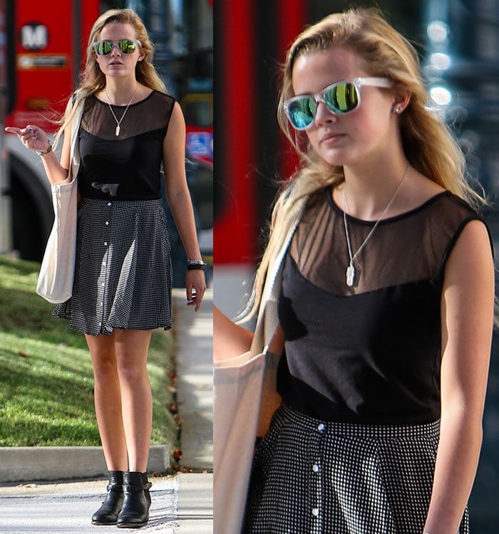 Ava Elizabeth Phillippe flashed her legs in a black-and-white checkered MinkPink skirt