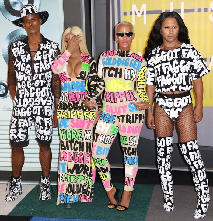 Amber Rose and Blac Chyna in dresses covered in words including “slut,” “stripper,” “gold digger,” and “bitch”