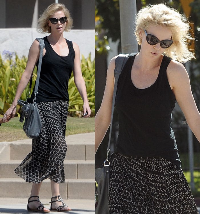 Charlize Theron wore an all-black-and-white boho look for her stroll, including a pair of beaded sandals