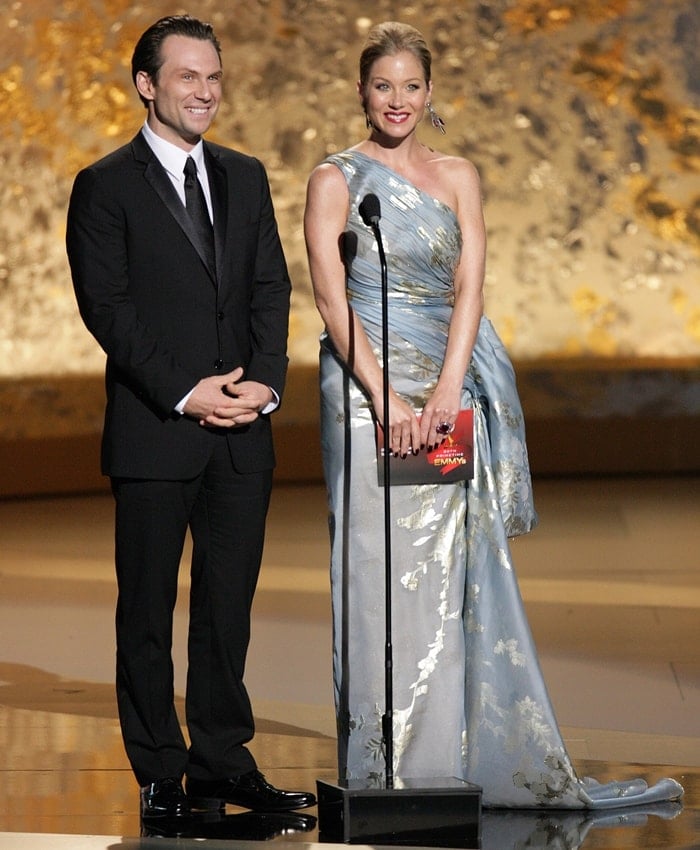 Presenters Christian Slater and Christina Applegate speak onstage during the 60th Primetime Emmy Awards