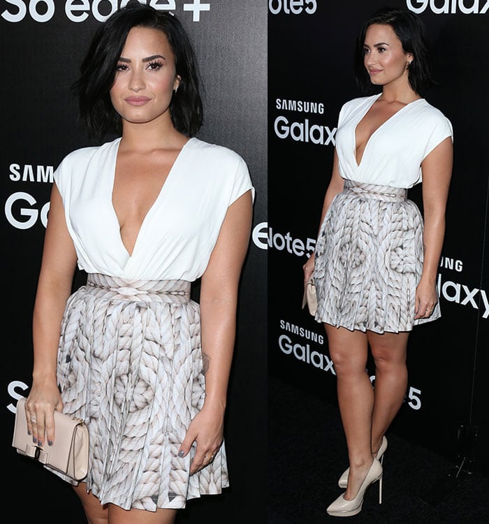 Demi Lovato in a white L’Agence top featuring a cleavage-baring surplice neckline