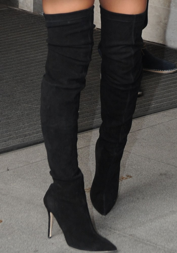 Emily Ratajkowski shows off the detailing of her Brian Atwood boots