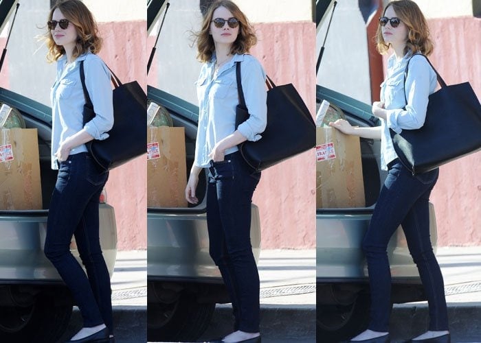 Emma Stone keeps things business casual as she approaches a box of props on the set of "La La Land"