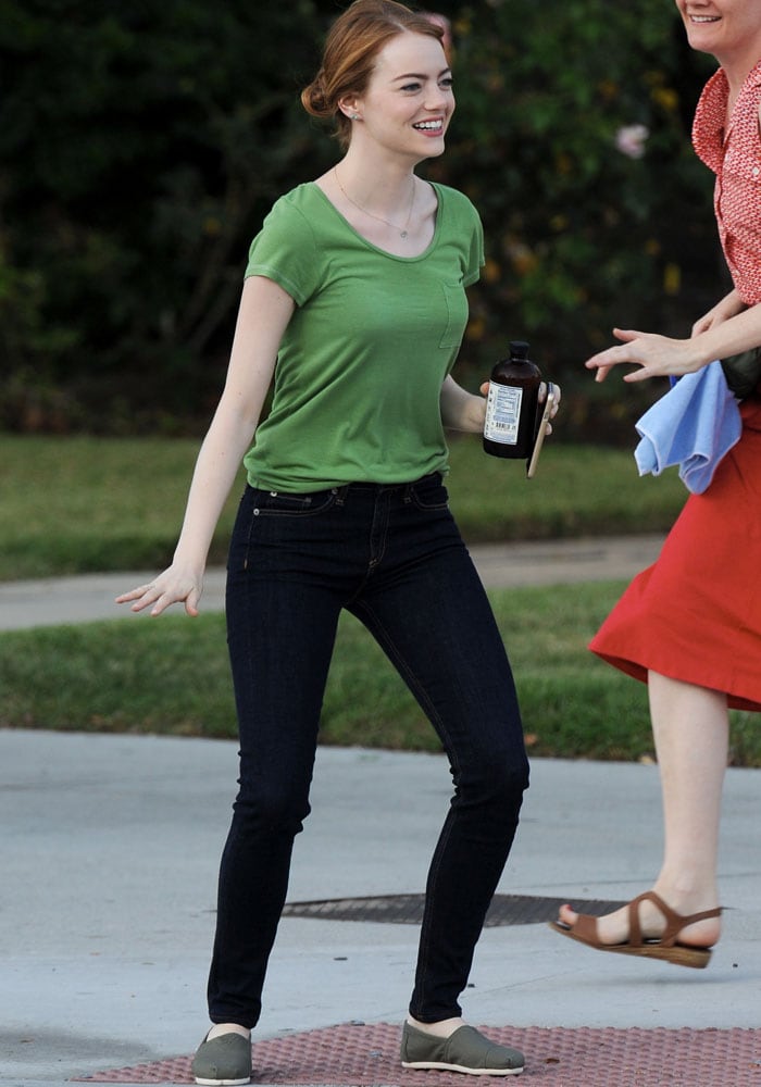 Emma Stone goofs around with the film crew of La La Land in Pasadena on August 18, 2015