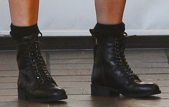 Fergie wears a pair of military-style boots from her own footwear line