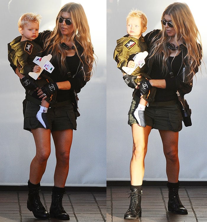 Fergie carries her son, Axl, as the two arrive at Chin Chin restaurant for a party in honor of Axl's second birthday