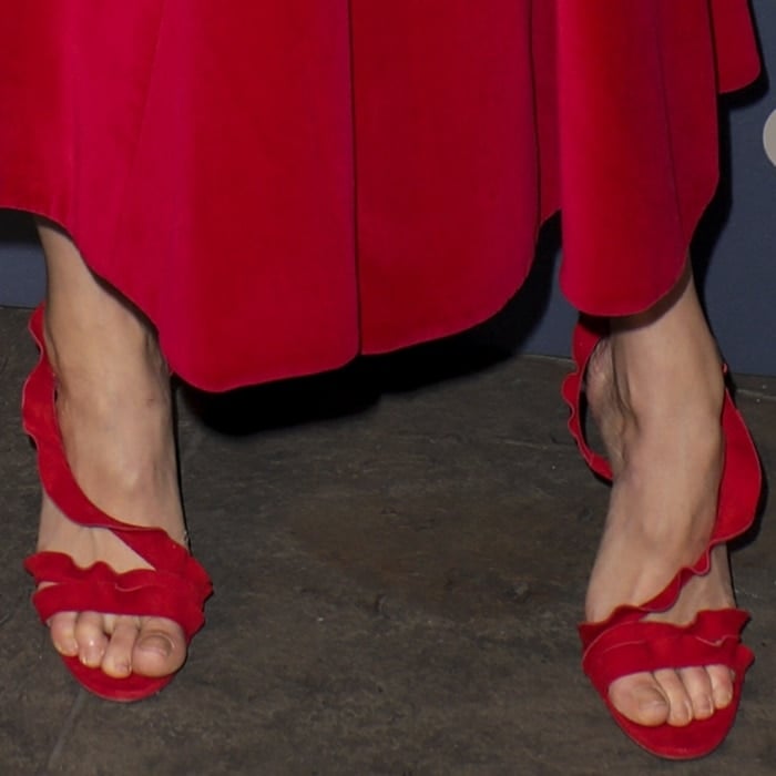 Gemma Arterton shows off her pedicure in red Aquazzura ruffled suede sandals