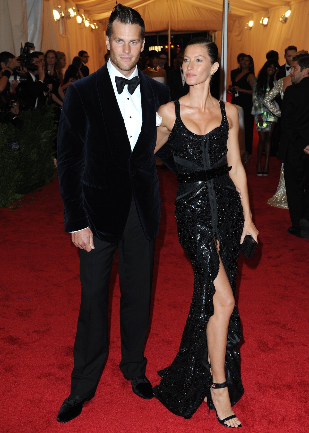 Gisele Bündchen in a dramatic sleeveless sexy black Givenchy dress and Tom Brady in a Tom Ford suit at the 2012 Met Gala