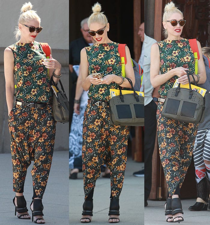 Gwen Stefani finishes off her outfit with black accessories, including a handbag and stilettos