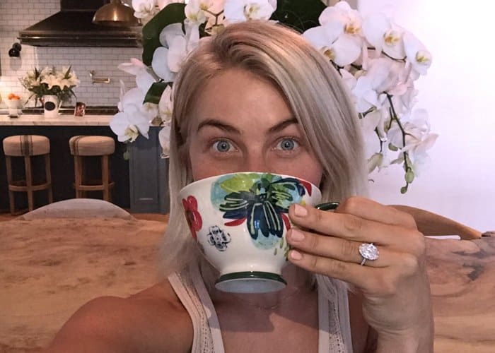 Close-up of Julianne Hough's breathtaking $350,000 engagement ring, featuring a 6 karat oval solitaire diamond by Lorraine Schwartz