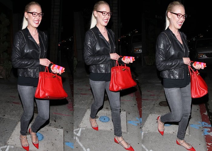 Katherine Heigl matches her bright red flats to her bright red handbag and phone case as she strolls through Los Angeles