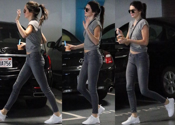 Kendall Jenner flaunts her legs in a tied shirt and skinny jeans