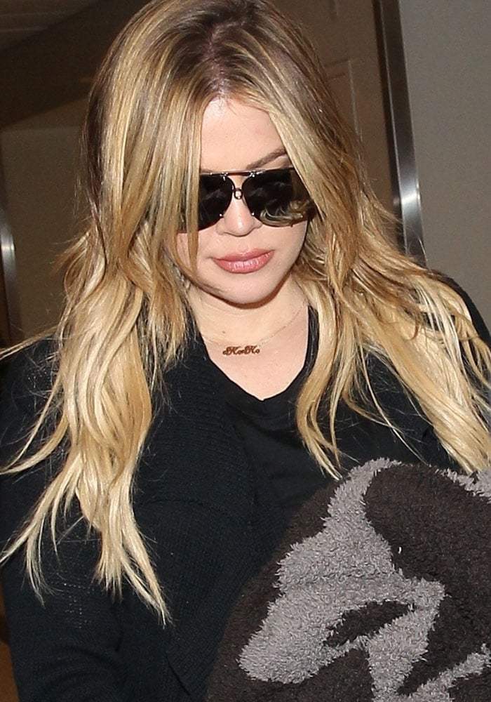 Khloe Kardashian arrives at Los Angeles International Airport on August 6, 2015