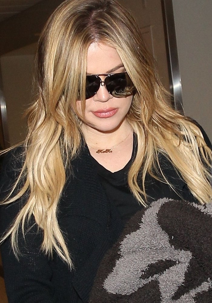 Khloé Kardashian arrives at Los Angeles International Airport on August 6, 2015