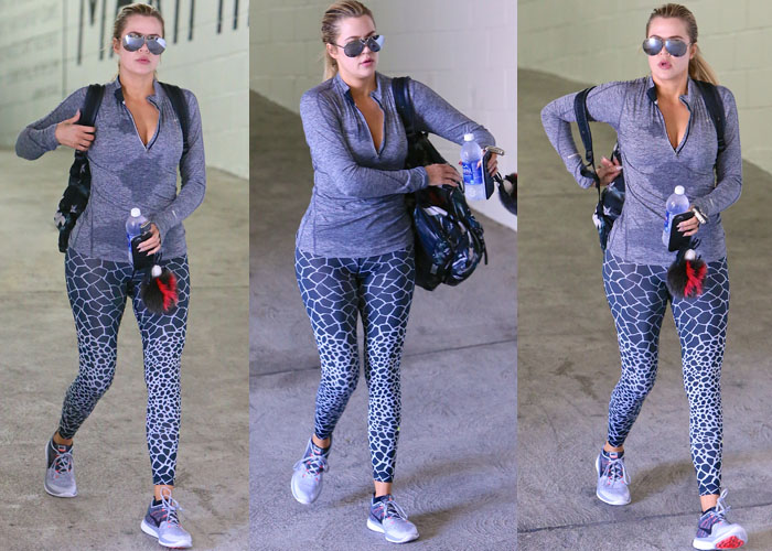 Khloé Kardashian carries a bottle of water and sports a gray-and-black look on her Los Angeles gym outing