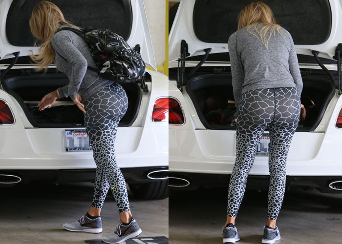 Khloé Kardashian flashes her black backpack to the cameras before she loads it into the trunk of a white car