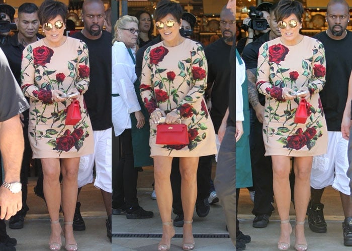 Kris Jenner styles a floral-printed dress from Dolce & Gabbana with a pair of nude heels as she attends a signing for her own cookbook