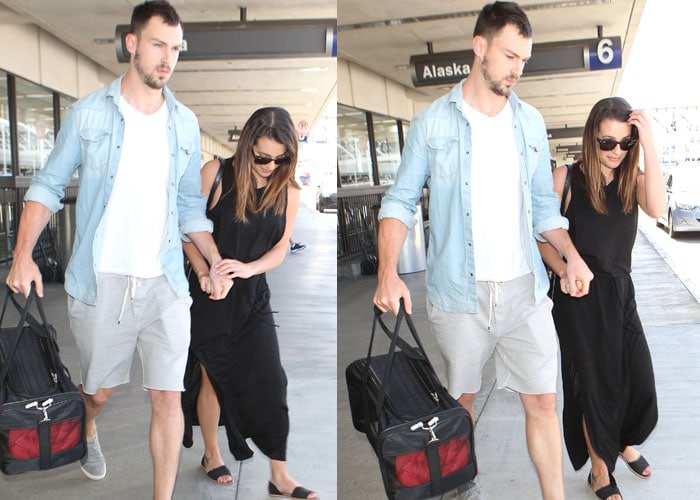 Lea Michele and boyfriend Matthew Paetz hold hands as they stroll through airport arrivals