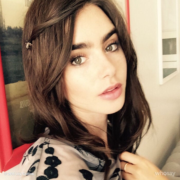 Lily Collins shows off her shoulder-length extensions which she wore for a day