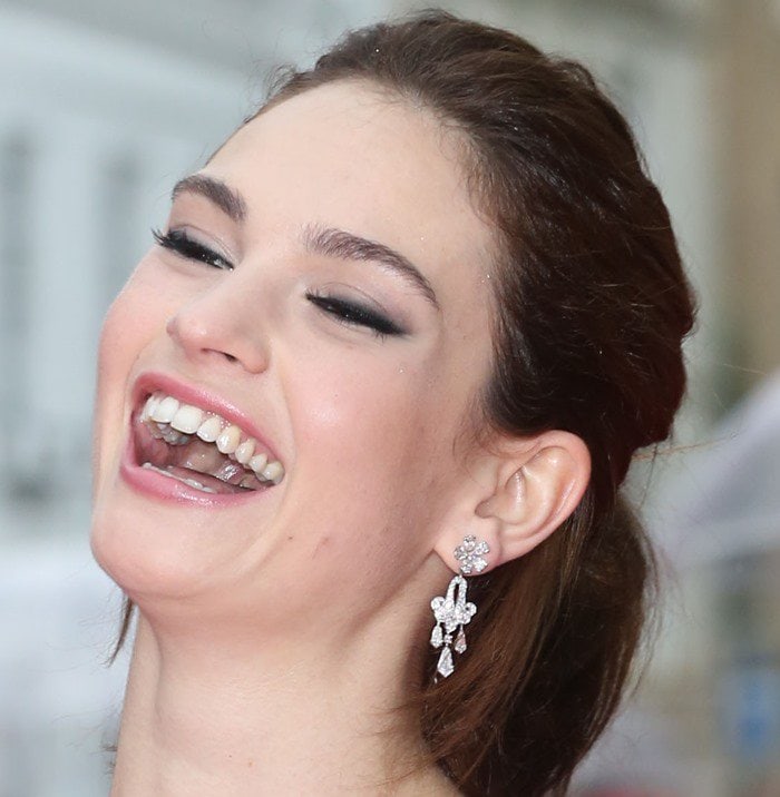 Lily James smiling at the BAFTA Tribute To ‘Downton Abbey’ event
