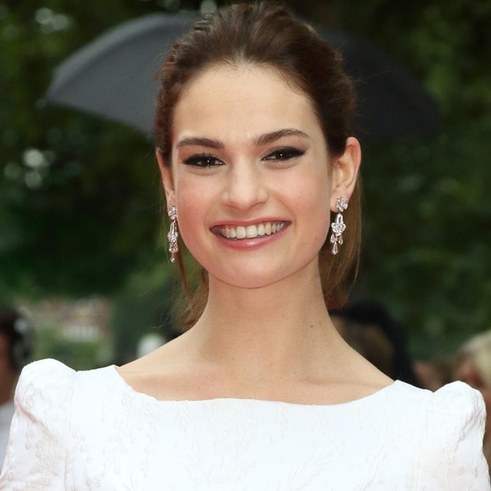 Lily James shows off her dazzling silver drop earrings