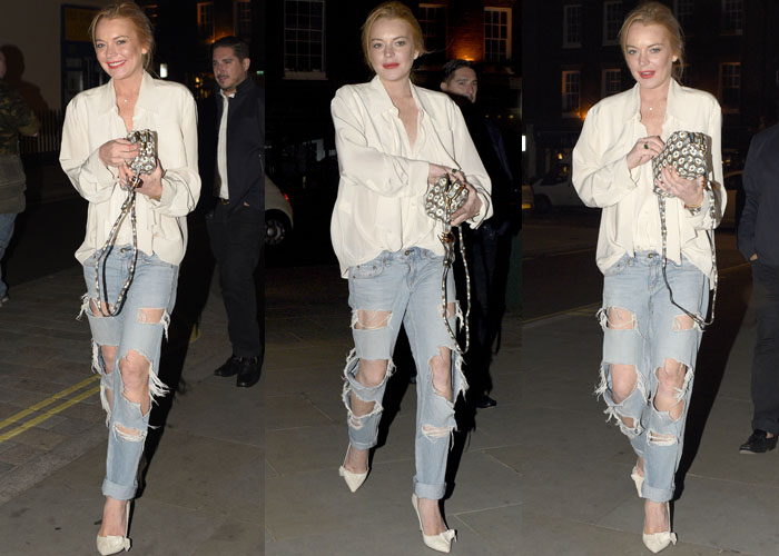 Lindsay Lohan, standing at 5’4¾” (164.5 cm), elevated her casual ripped jeans and loose blouse with leg-lengthening Isabel Marant "Poppy" white snakeskin pumps and a playful printed clutch