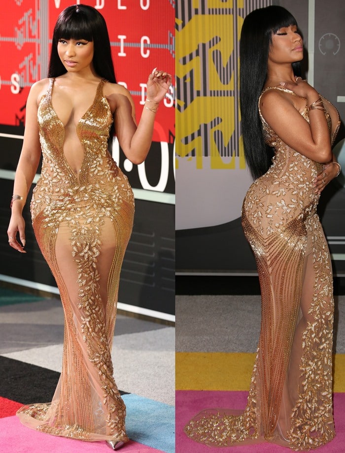 Nicki Minaj poses and shows off her pearl-embellished gown at the VMAs