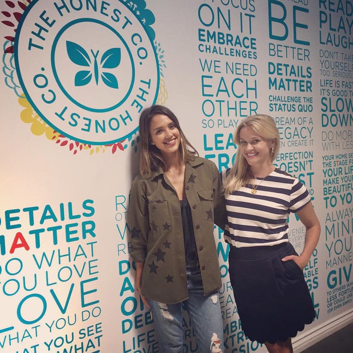 Reese Witherspoon and Jessica Alba pose for a photo at The Honest Company office