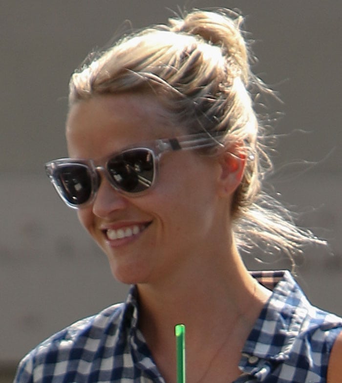 Reese Witherspoon's blonde hair tied up in a bun