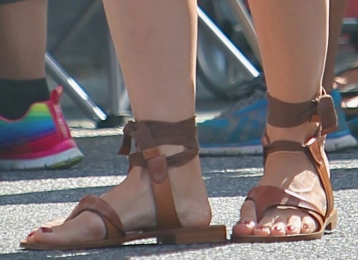 Selma Blair shows off a ruby red pedicure in Sarah Flint sandals 