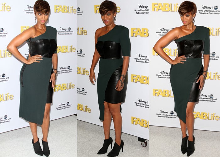 Tyra Banks flaunted her legs in a leather bustier dress by Bryan Hearns