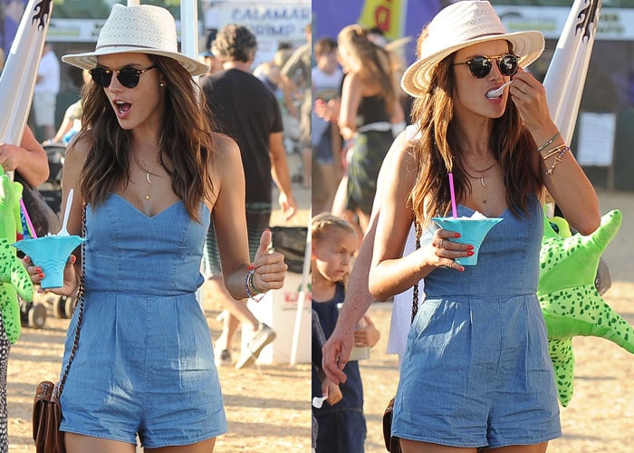 Alessandra Ambrosio takes a bite of a frozen treat as she spends a day at the fair