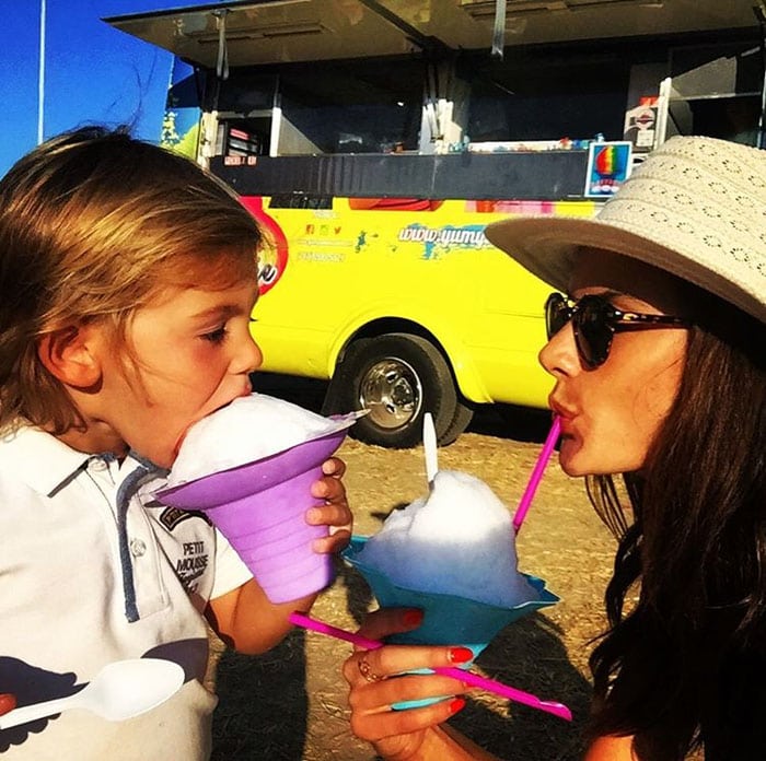 Alessandra eats an iced treat with her son Noah at the Malibu Fair