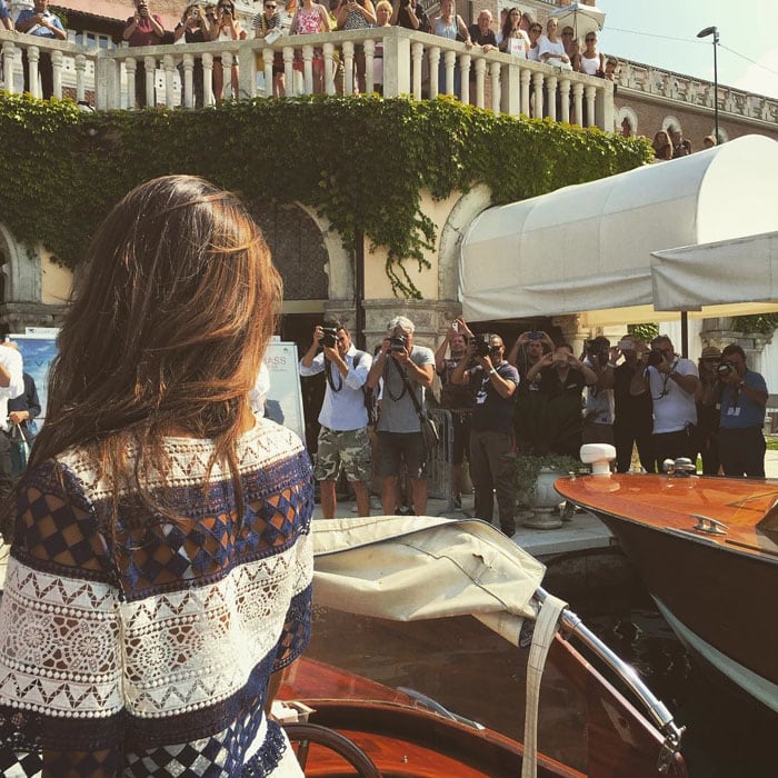 Alessandra Ambrosio uploads a photo of her surrounded by photographers in Venice with the caption, "Ciao Belli ✨🇮🇹✨ #Venezia #venicefilmfestival"