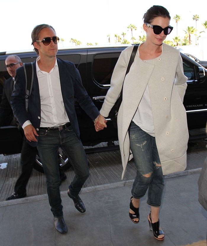 Anne Hathaway and Adam Shulman arrive at Los Angeles International Airport