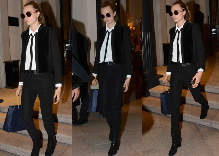 Cara Delevingne shows how to nail androgynous chic with a tailored black blazer, slim tie, fitted black jeans, and suede ankle boots—perfect for a polished yet edgy vibe