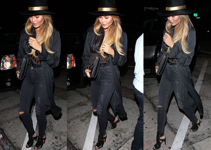 Chrissy Teigen turns heads in an all-black ensemble featuring a sheer top, distressed skinny jeans, a Eugenia Kim Georgina hat, a Chloé Faye bag, and Christian Louboutin Hippik cutout leather ankle boots
