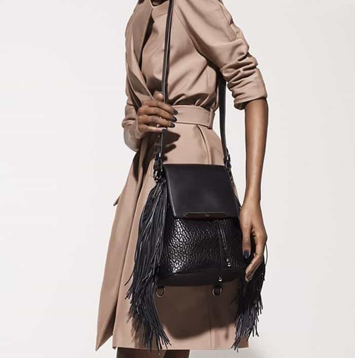 Pebbled leather fringe handbag exuding rock-star attitude and Louboutin glamour