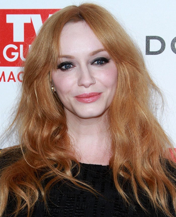 Christina Hendricks wears her red hair down and in loose waves at a pre-Emmy party