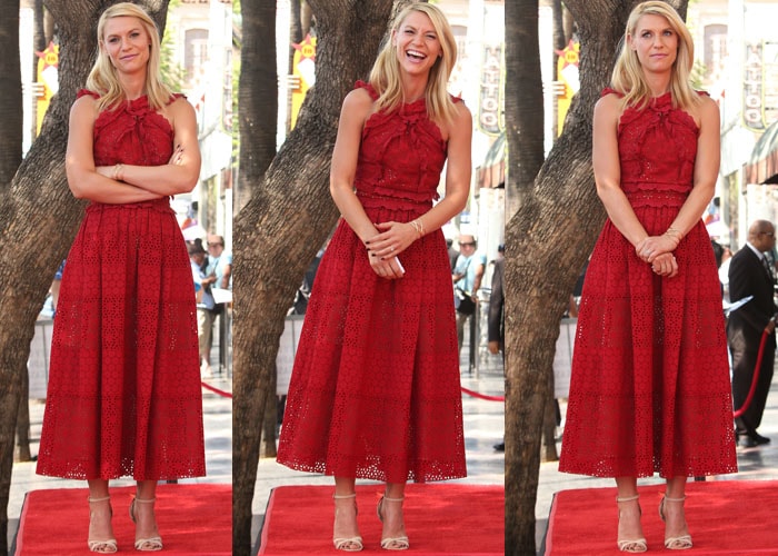 Claire Danes poses on the red carpet in a red Oscar de la Renta dress